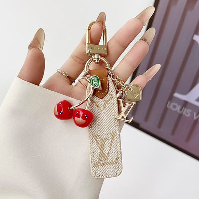 louis vuitton Cherry Charm Keychain with Monogram Leather Strap Luxury Designer Bag and Key Accessory