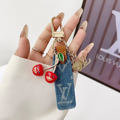louis vuitton Cherry Charm Keychain with Monogram Leather Strap Luxury Designer Bag and Key Accessory