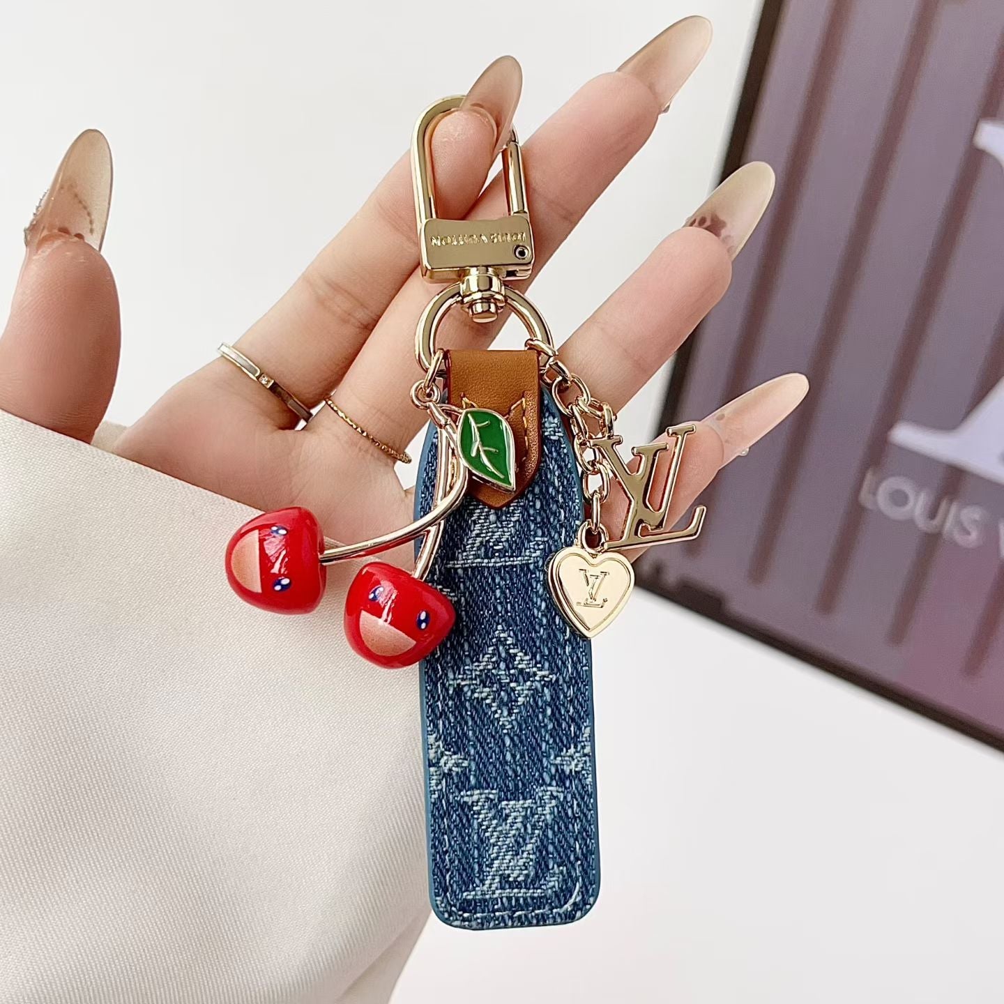 louis vuitton Cherry Charm Keychain with Monogram Leather Strap Luxury Designer Bag and Key Accessory