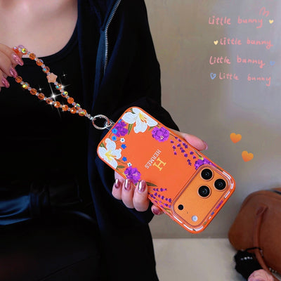 Hermès Floral Signature Case with Wrist Charm for iPhone 13 to 17 Pro Max